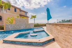 Petra-Beige-Brittannia-Cathedral-2x6-Toscano-Pavers-Coping-pool-by-South-Shore-Pools13-scaled