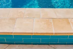Petra-Beige-Brittannia-Cathedral-2x6-Toscano-Pavers-Coping-pool-by-South-Shore-Pools37-scaled